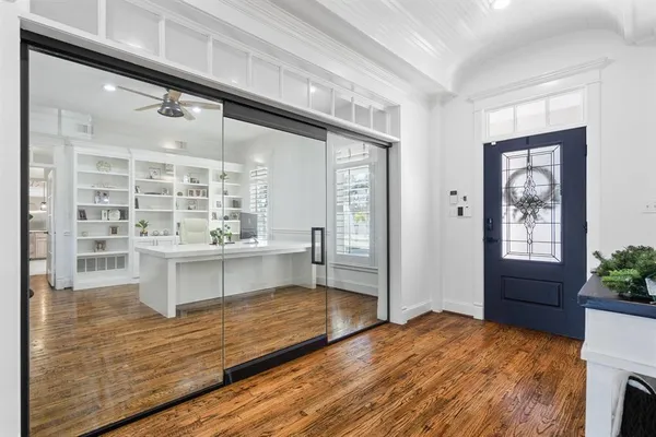 a kitchen with stainless steel appliances kitchen island granite countertop a stove and a large window