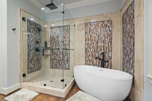 a bathroom with a bathtub and shower