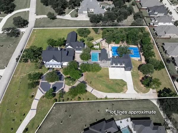 an aerial view of house with yard