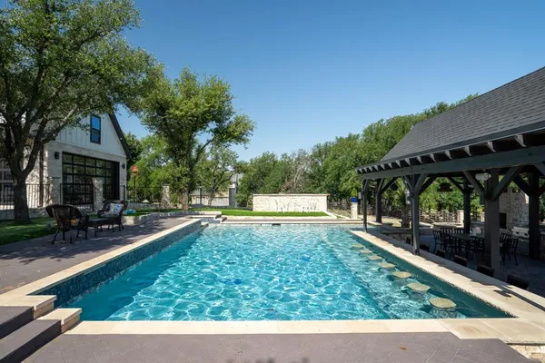 a view of a swimming pool with a patio