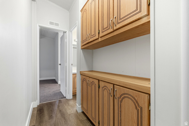 150 West 7500th South, Unit 55 Midvale, UT 84047 - Photo 19 of 28 Hallway with dark wood-style floors and ornamental molding