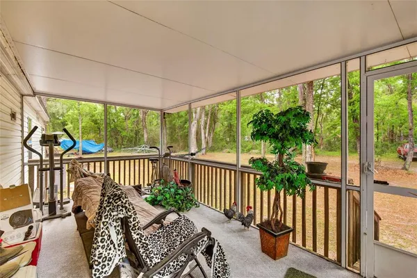 a view of a porch with furniture