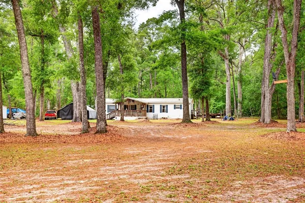 a house with trees in front of it