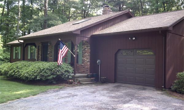 85 North Plain Road Sunderland, MA 01375 - Photo 1 of 13 a front view of a house with garden