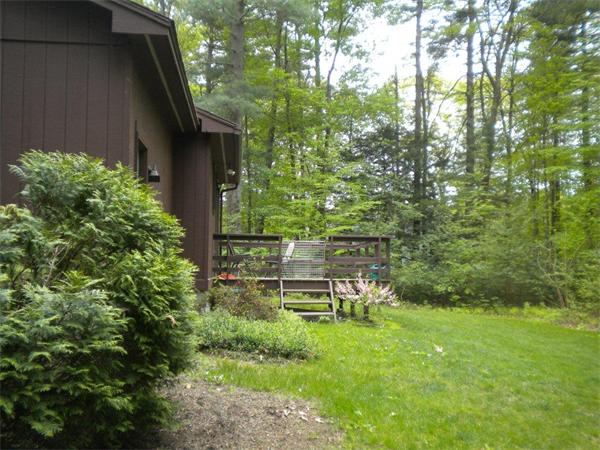 85 North Plain Road Sunderland, MA 01375 - Photo 4 of 13 a backyard of a house with table and chairs