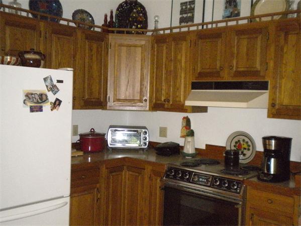 85 North Plain Road Sunderland, MA 01375 - Photo 8 of 13 a kitchen with a stove and a refrigerator