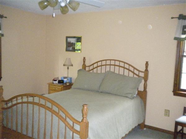 85 North Plain Road Sunderland, MA 01375 - Photo 10 of 13 a bedroom with a bed and window