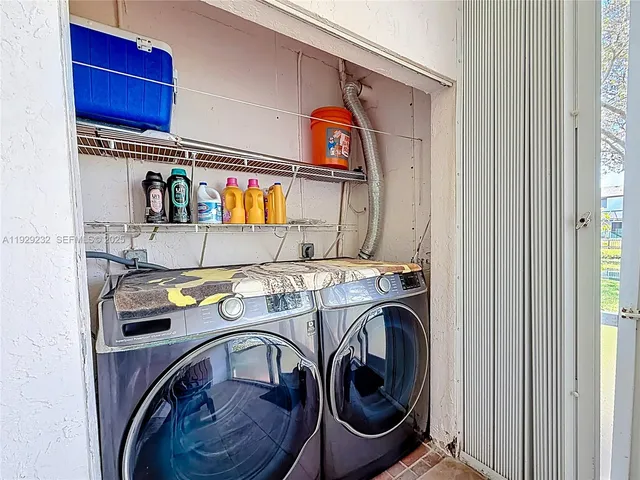 a utility room with dryer and washer