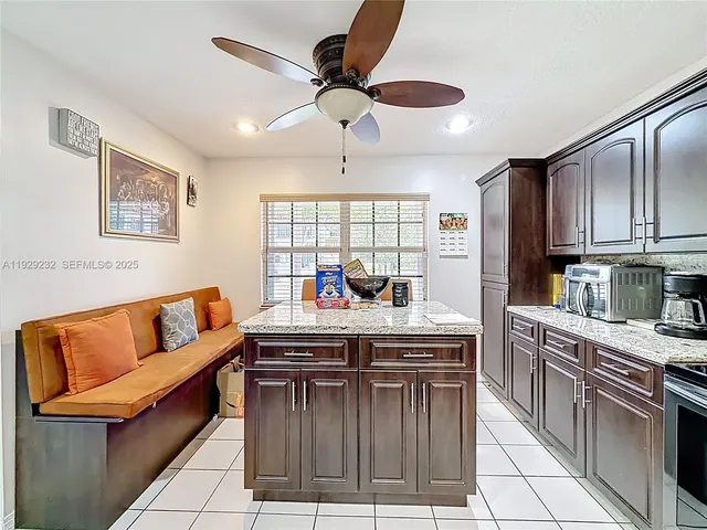 a kitchen with stainless steel appliances granite countertop a stove and a sink