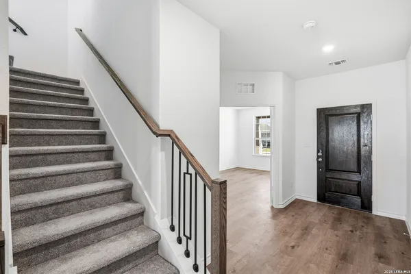 a view of a hallway with staircase