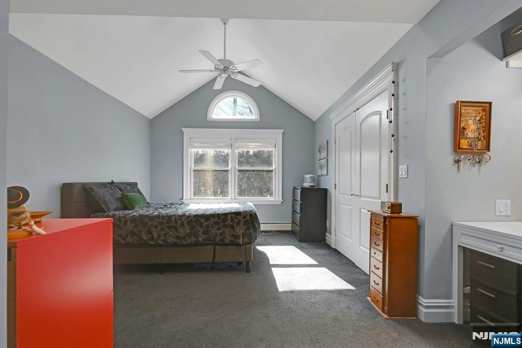 285 Chestnut Ridge Road Woodcliff Lake, NJ 07677 - Photo 29 of 46 a bedroom with furniture and a window