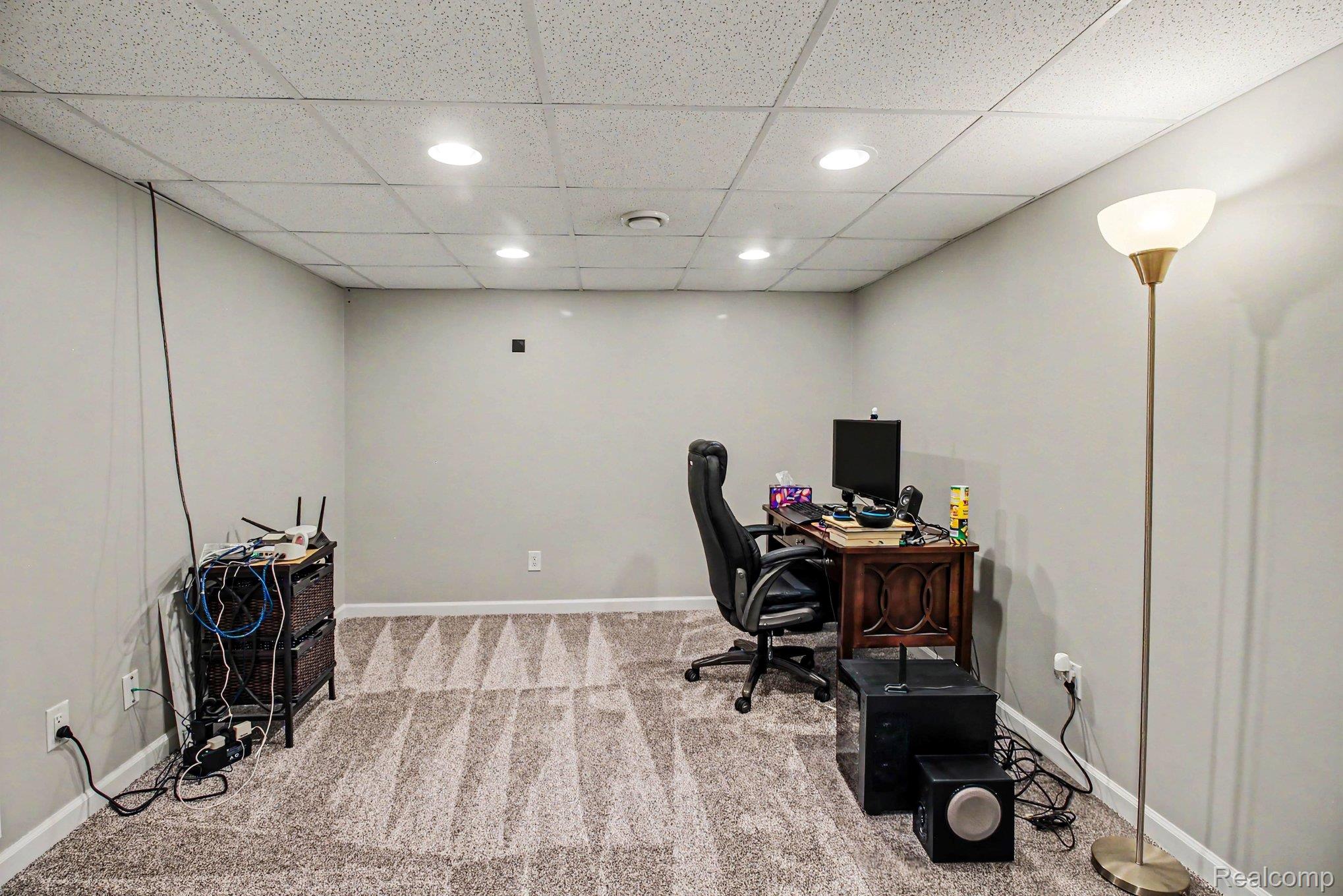 5183 North Owosso Road Fowlerville, MI 48836 - Photo 19 of 27 Home office featuring light colored carpet, recessed lighting, and a paneled ceiling