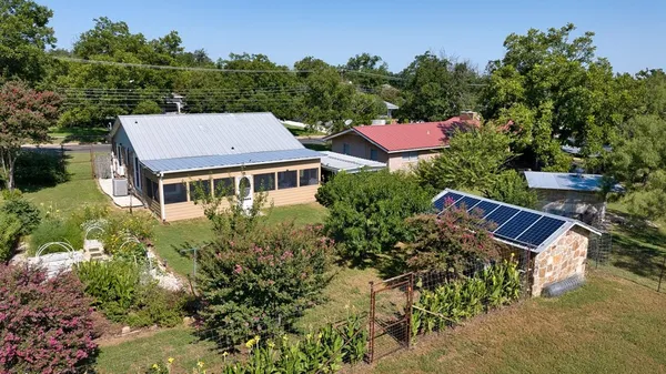 an aerial view of houses with yard