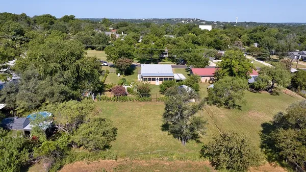 an aerial view of residential house with beach and outdoor space