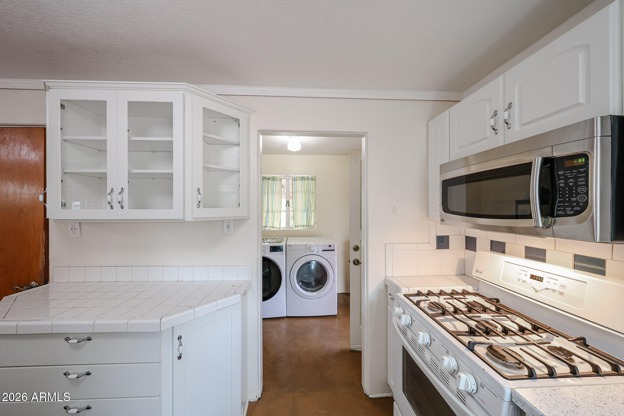 3108 North 21st Place Phoenix, AZ 85016 - Photo 19 of 56 a living room with furniture and a flat screen tv