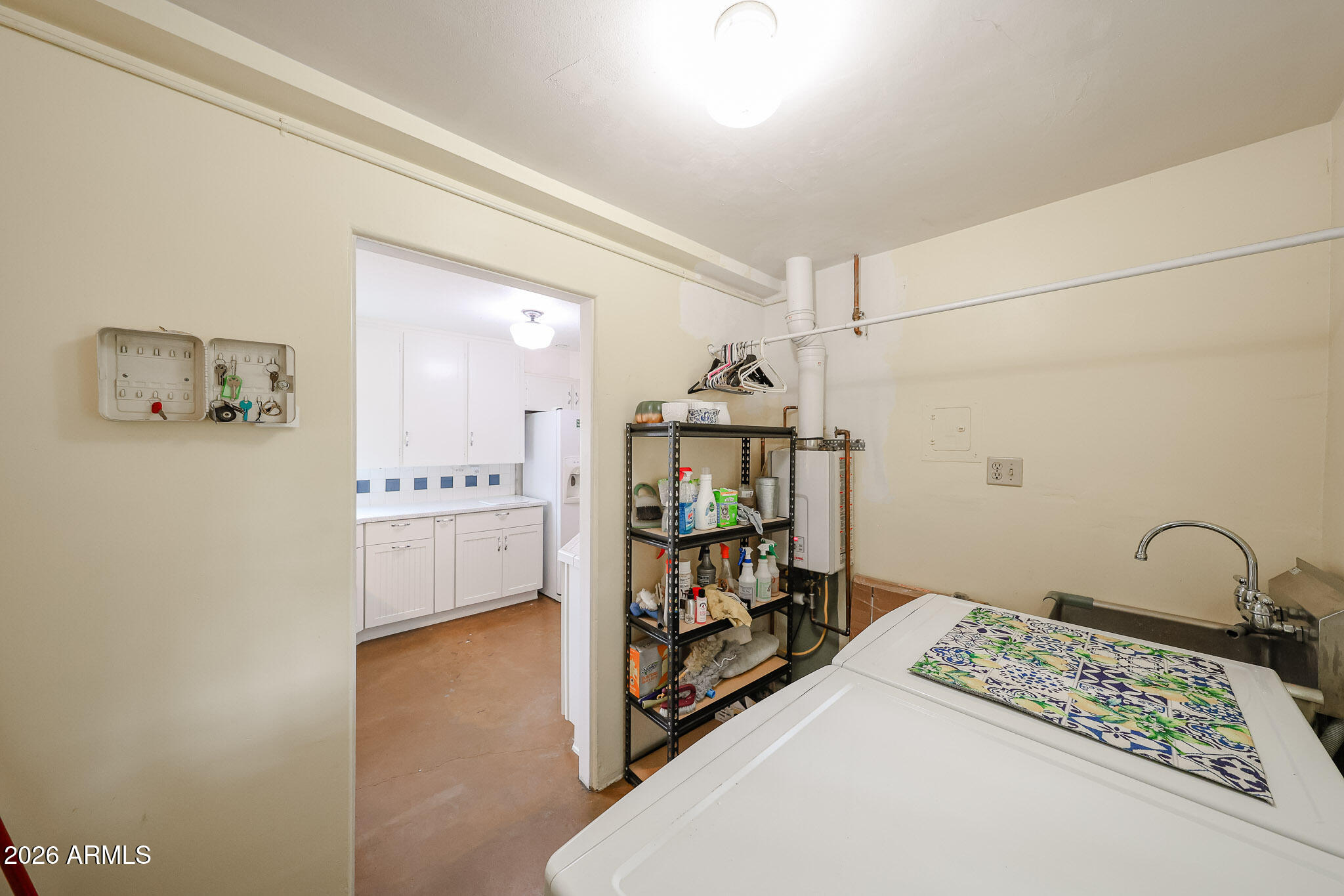 3108 North 21st Place Phoenix, AZ 85016 - Photo 21 of 56 a view of a bedroom with baby bed and cabinet
