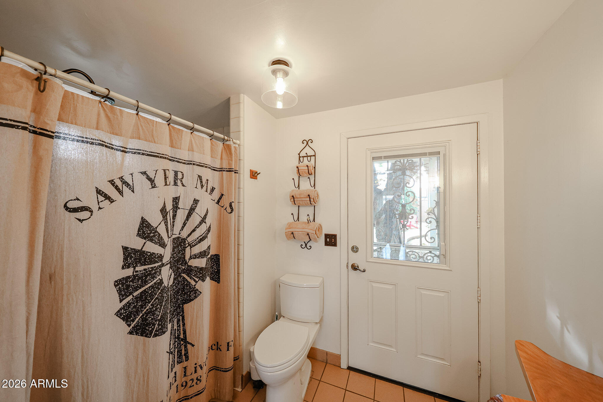3108 North 21st Place Phoenix, AZ 85016 - Photo 23 of 56 a bathroom with a toilet a sink and shower