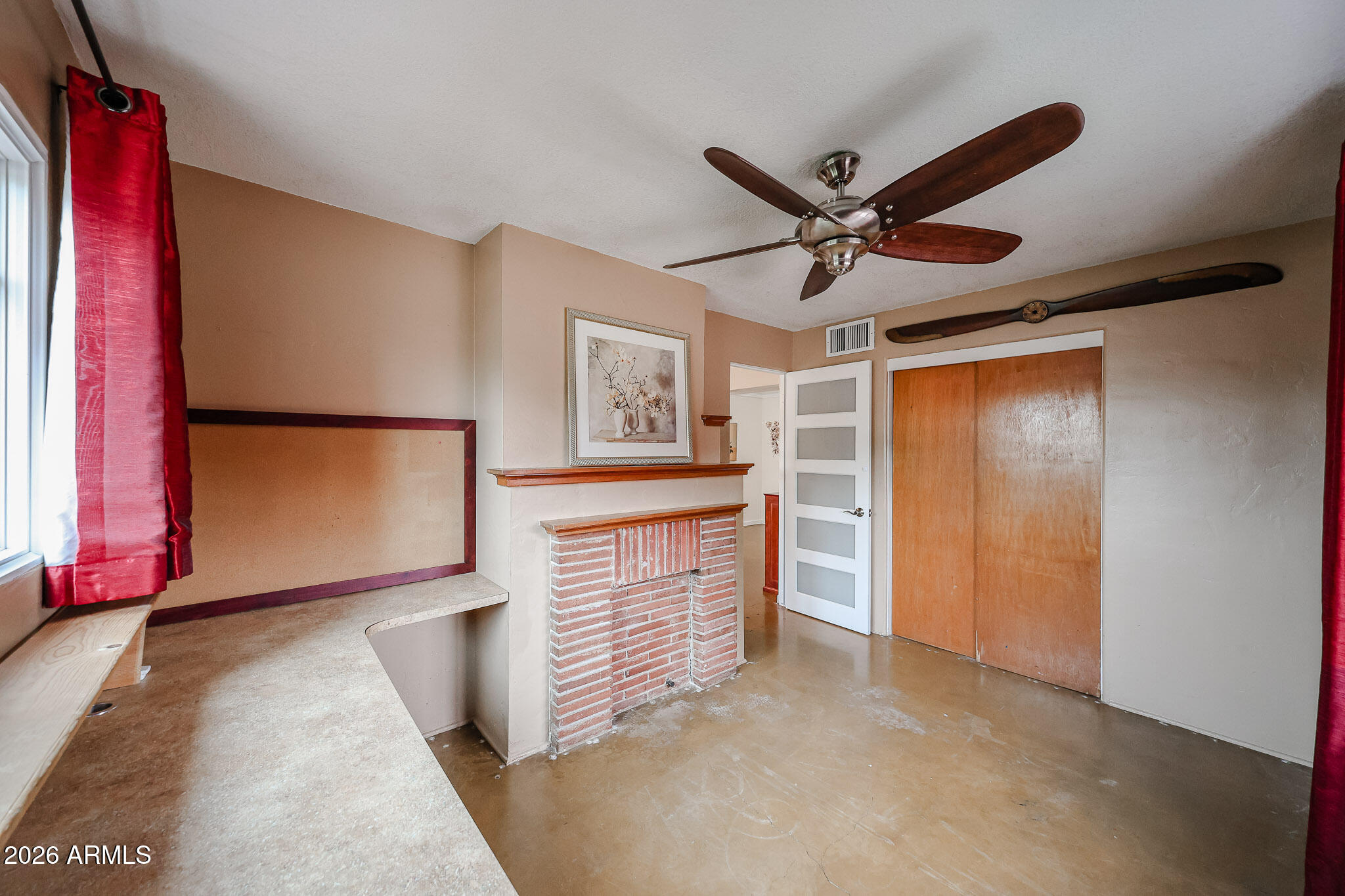 3108 North 21st Place Phoenix, AZ 85016 - Photo 29 of 56 a view of a kitchen with furniture and a ceiling fan