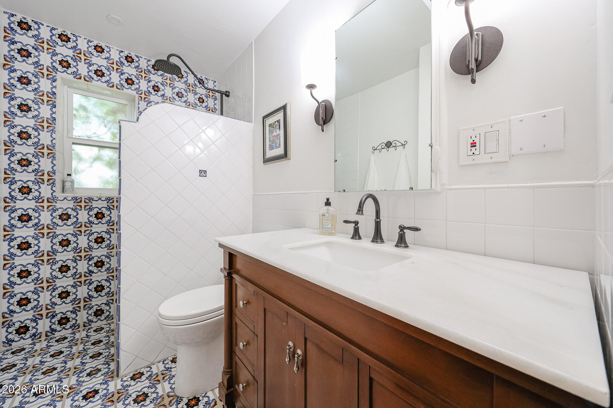 3108 North 21st Place Phoenix, AZ 85016 - Photo 30 of 56 a bathroom with a sink toilet and shower