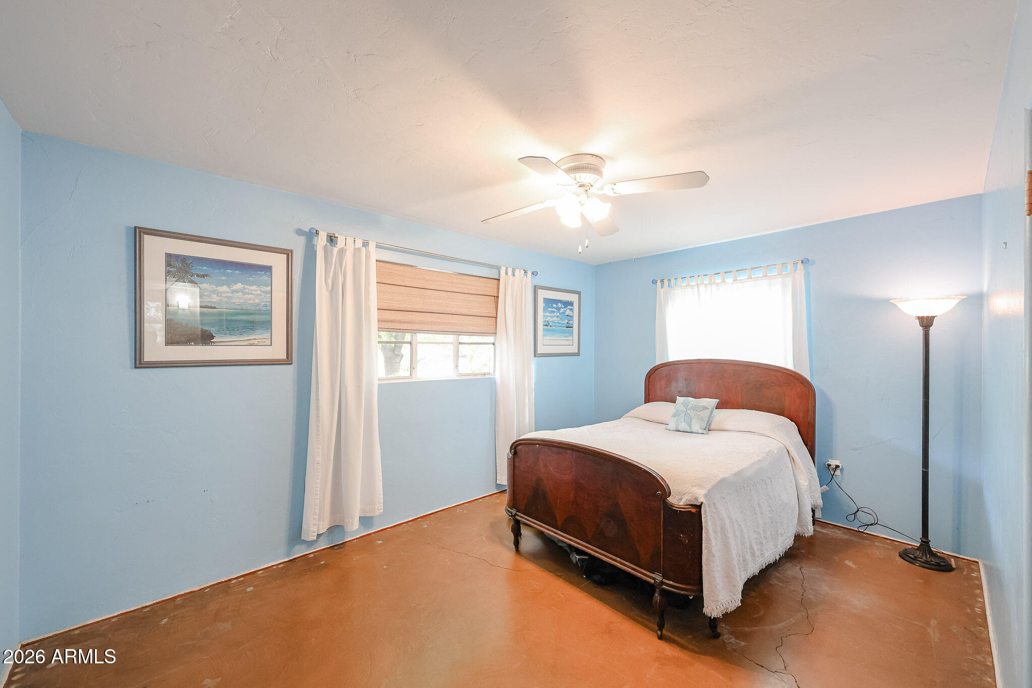 3108 North 21st Place Phoenix, AZ 85016 - Photo 36 of 56 a bedroom with a bed chandelier and a window