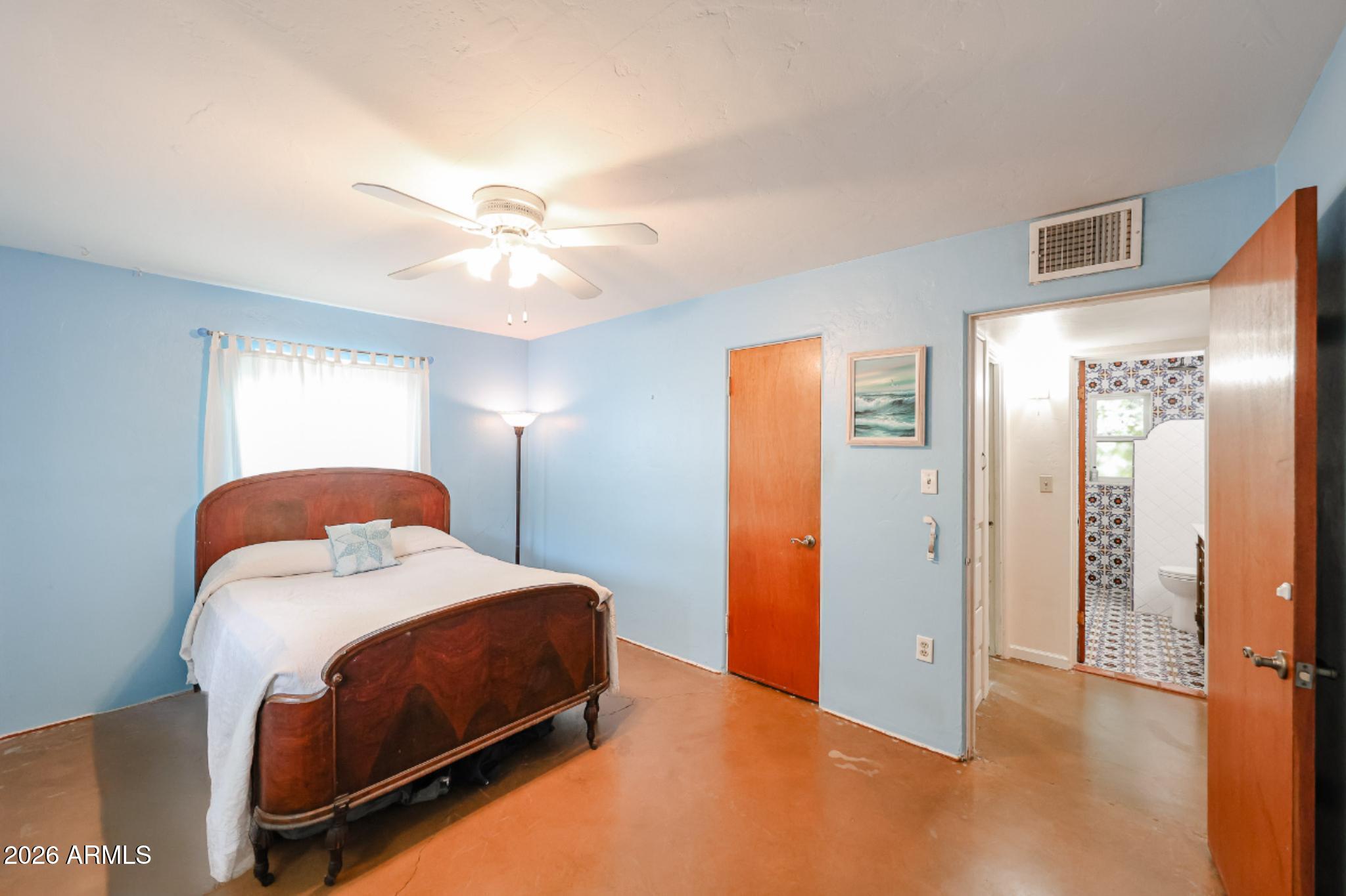 3108 North 21st Place Phoenix, AZ 85016 - Photo 37 of 56 a bedroom with a bed and a chandelier