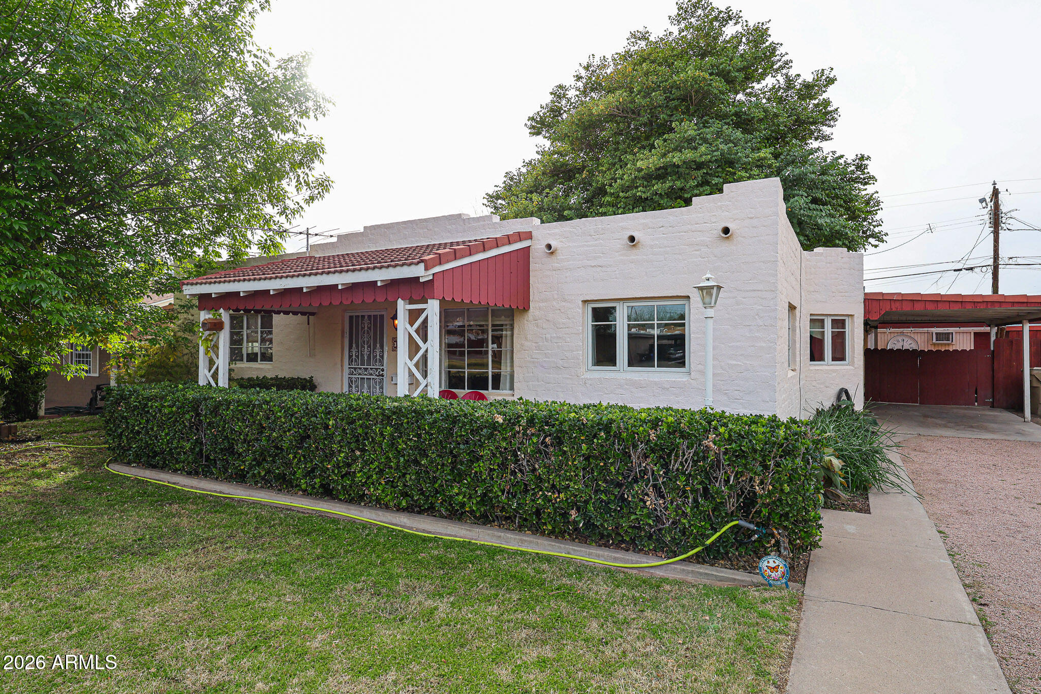 3108 North 21st Place Phoenix, AZ 85016 - Photo 4 of 56 a front view of a house with a yard