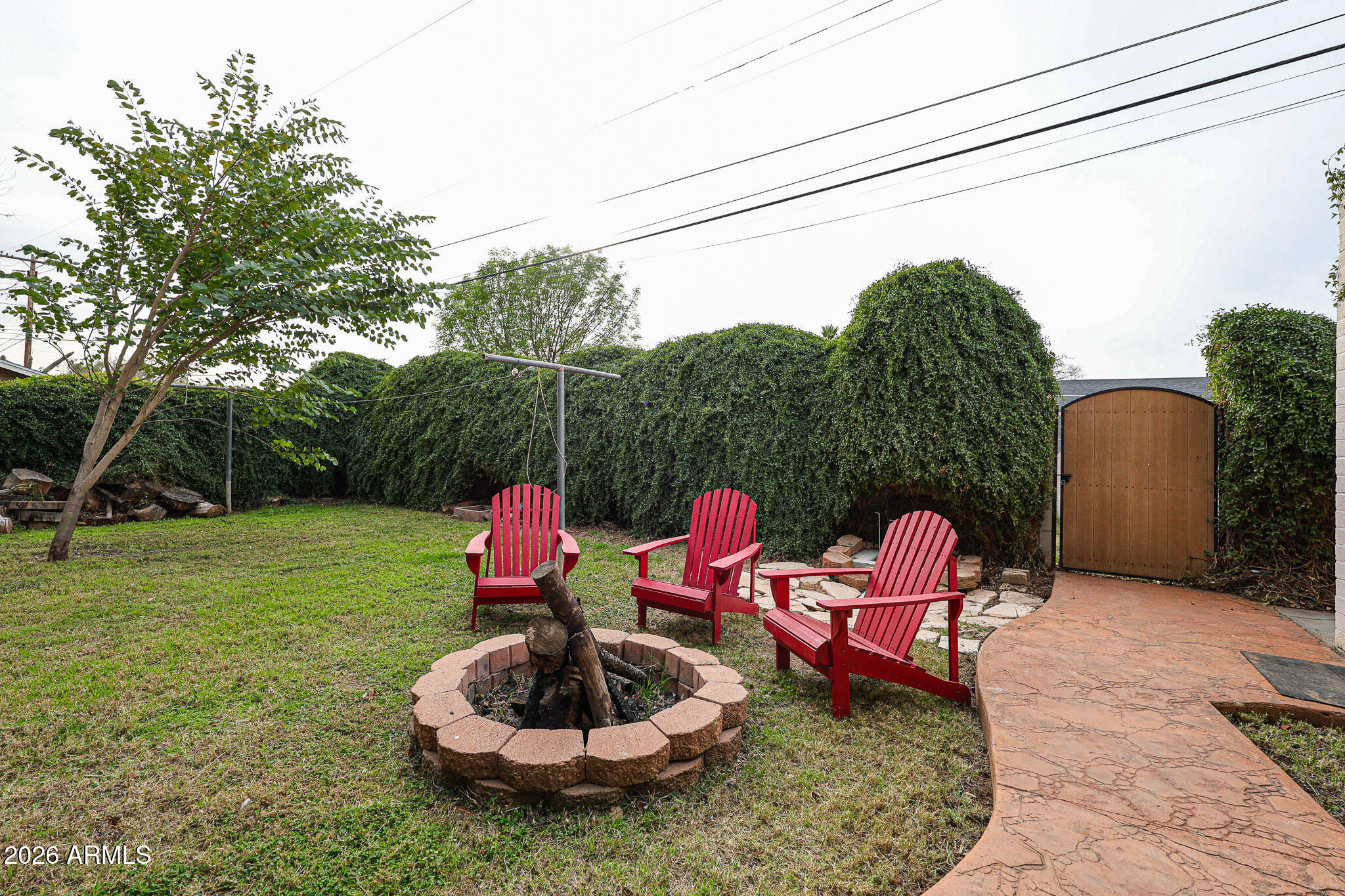 3108 North 21st Place Phoenix, AZ 85016 - Photo 41 of 56 a backyard of a house with table and chairs