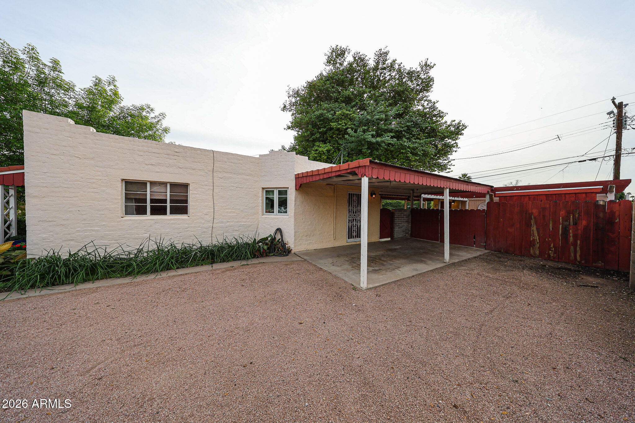 3108 North 21st Place Phoenix, AZ 85016 - Photo 5 of 56 a view of a house with a yard and garage