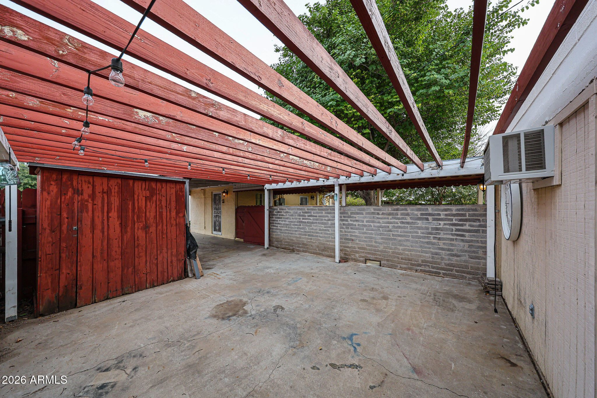 3108 North 21st Place Phoenix, AZ 85016 - Photo 55 of 56 a view of a house with a small yard and wooden fence