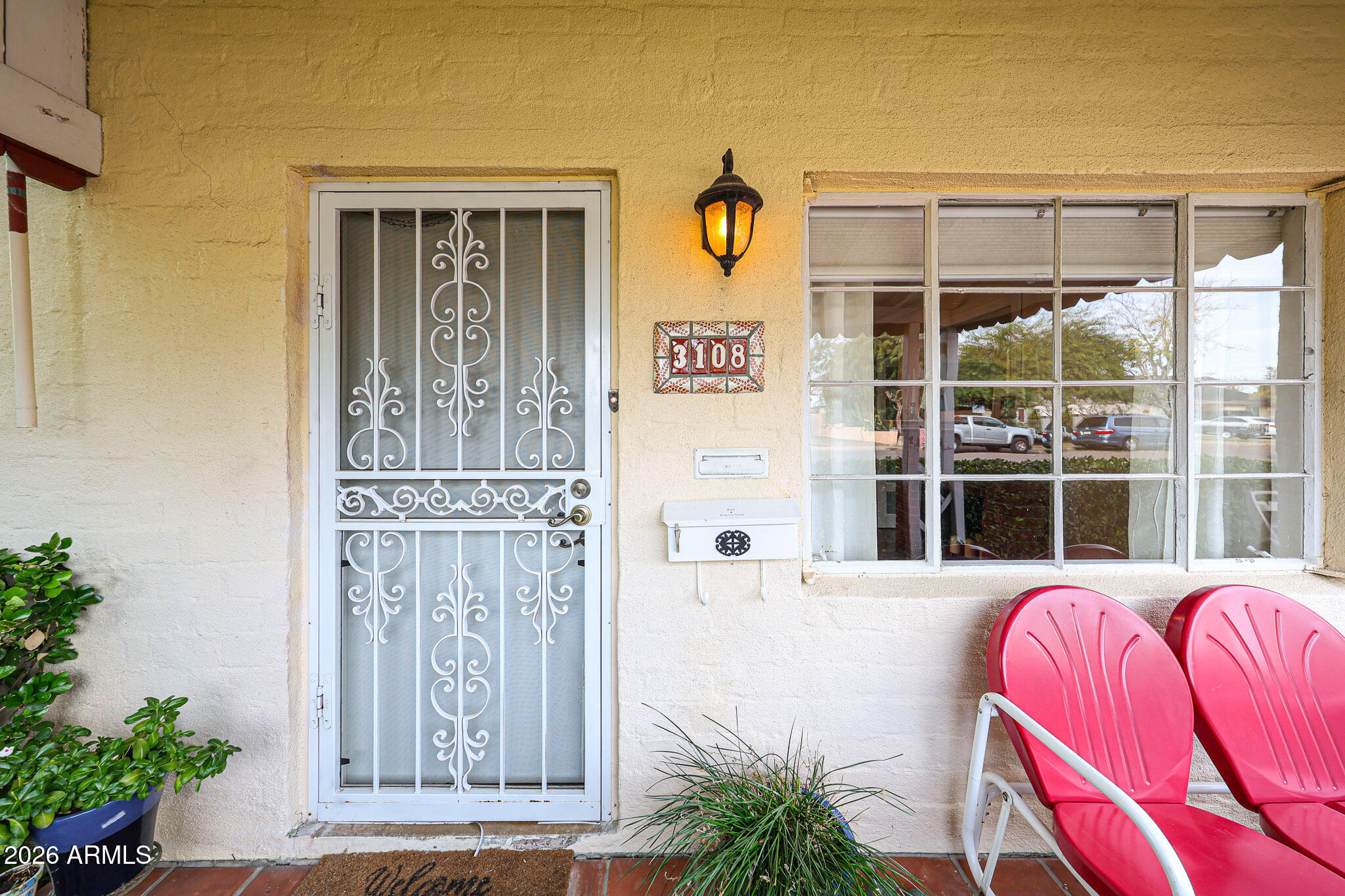 3108 North 21st Place Phoenix, AZ 85016 - Photo 7 of 56 a front view of a house with a porch