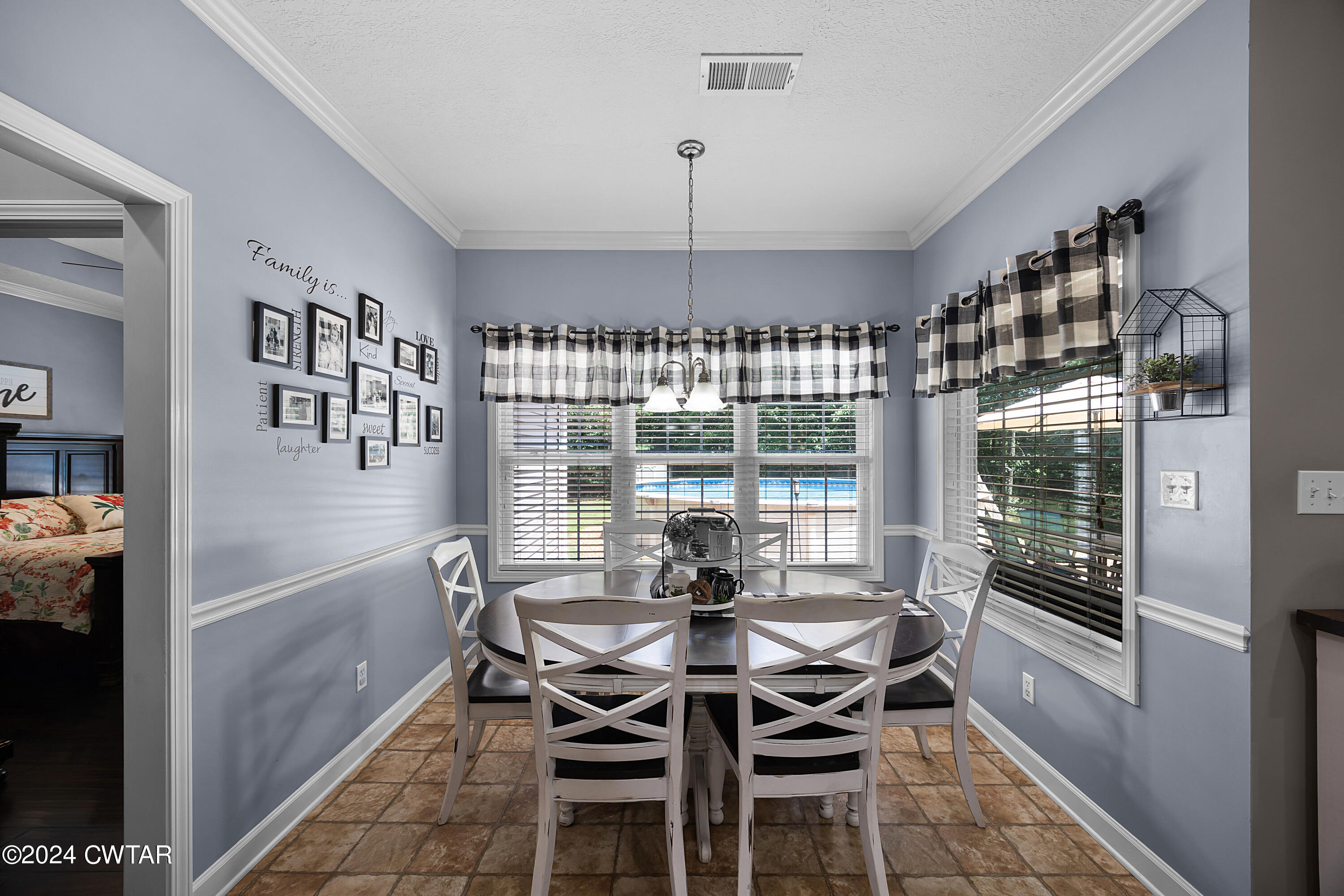 245 Station Road Beech Bluff, TN 38313 - Photo 11 of 23 a dining room with furniture a chandelier and window