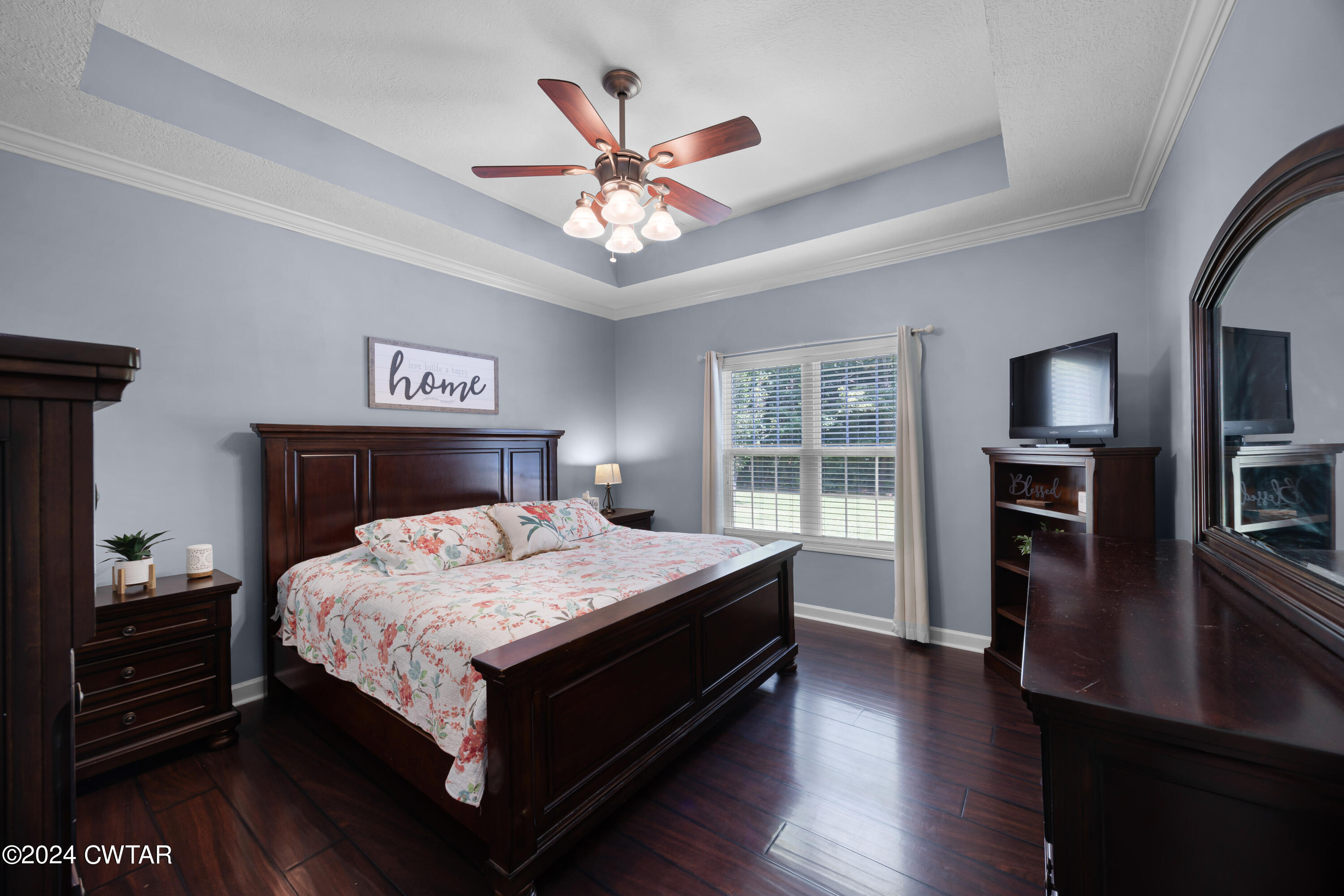 245 Station Road Beech Bluff, TN 38313 - Photo 15 of 23 a bedroom with a bed and a chandelier
