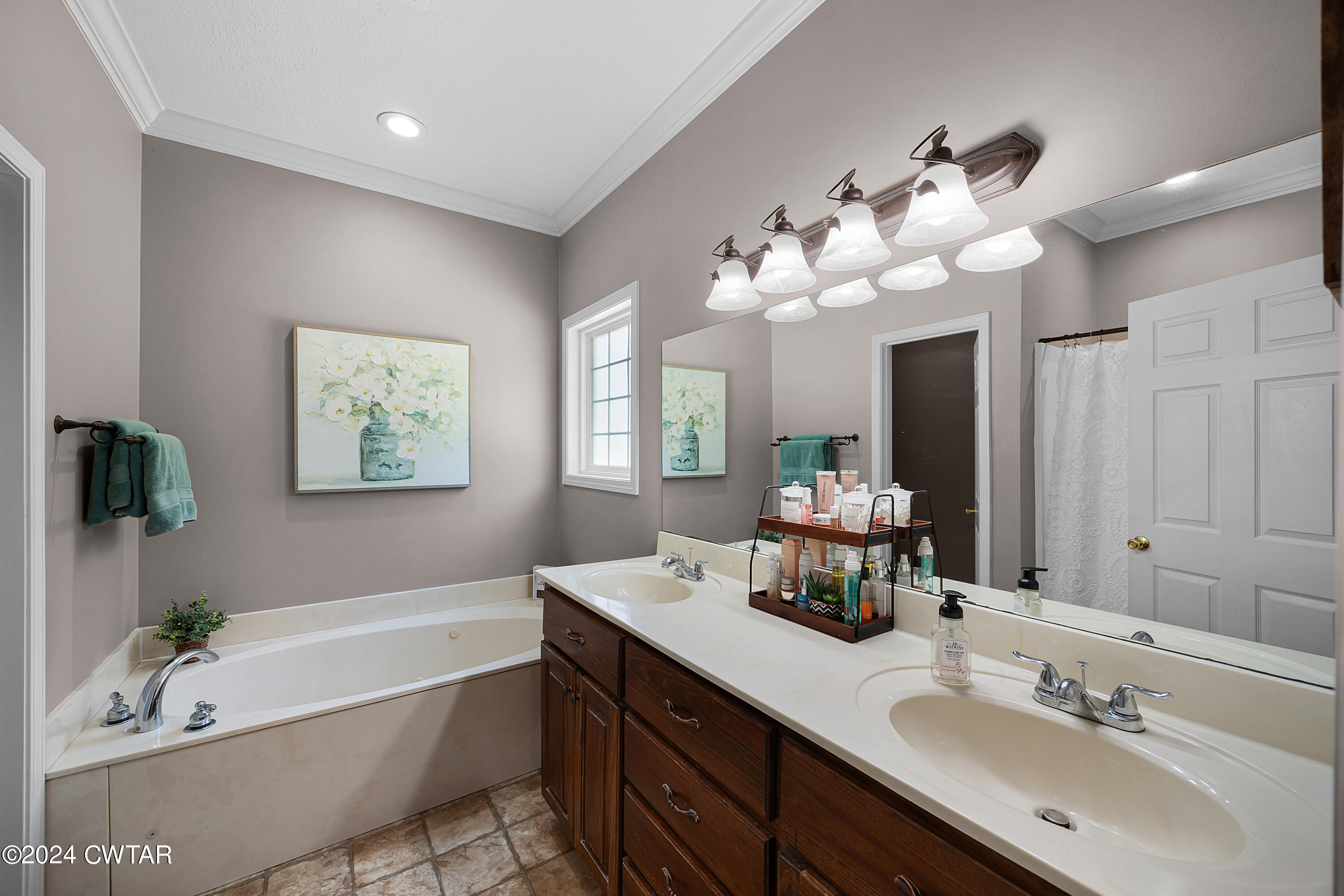 245 Station Road Beech Bluff, TN 38313 - Photo 16 of 23 a bathroom with a tub a double vanity sink and a mirror