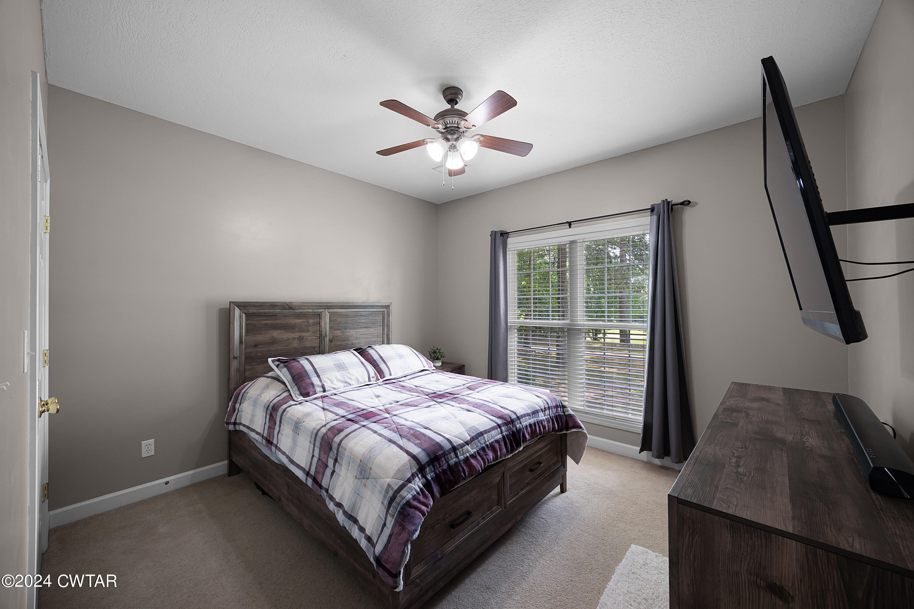 245 Station Road Beech Bluff, TN 38313 - Photo 17 of 23 a bedroom with a bed and a large window