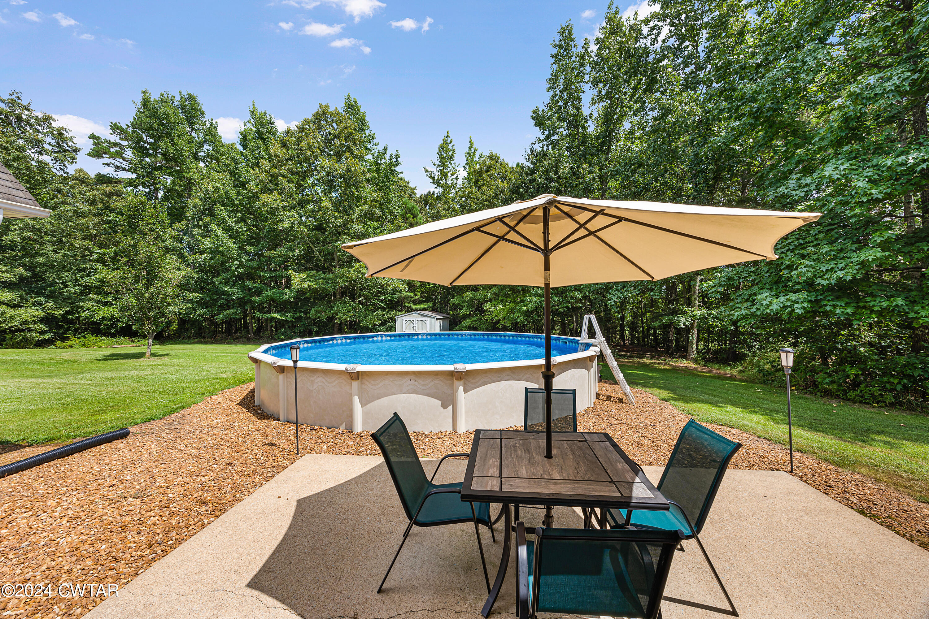 245 Station Road Beech Bluff, TN 38313 - Photo 4 of 23 a view of backyard with seating and green space