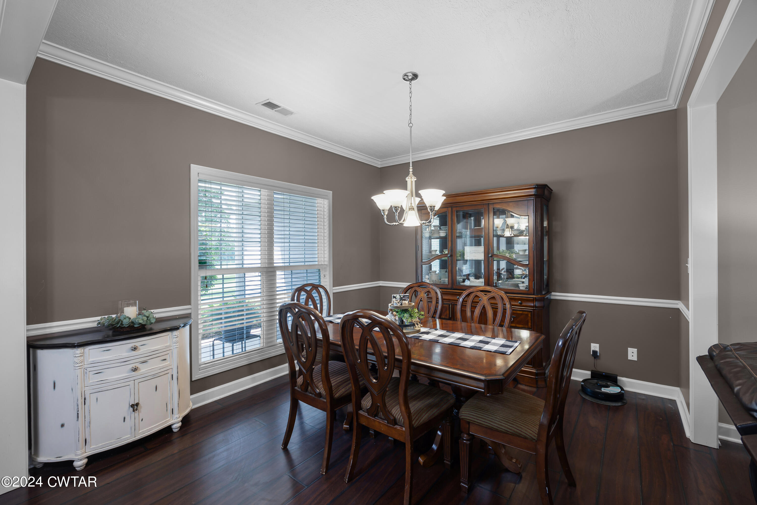 245 Station Road Beech Bluff, TN 38313 - Photo 6 of 23 a view of a dining room with furniture window and wooden floor