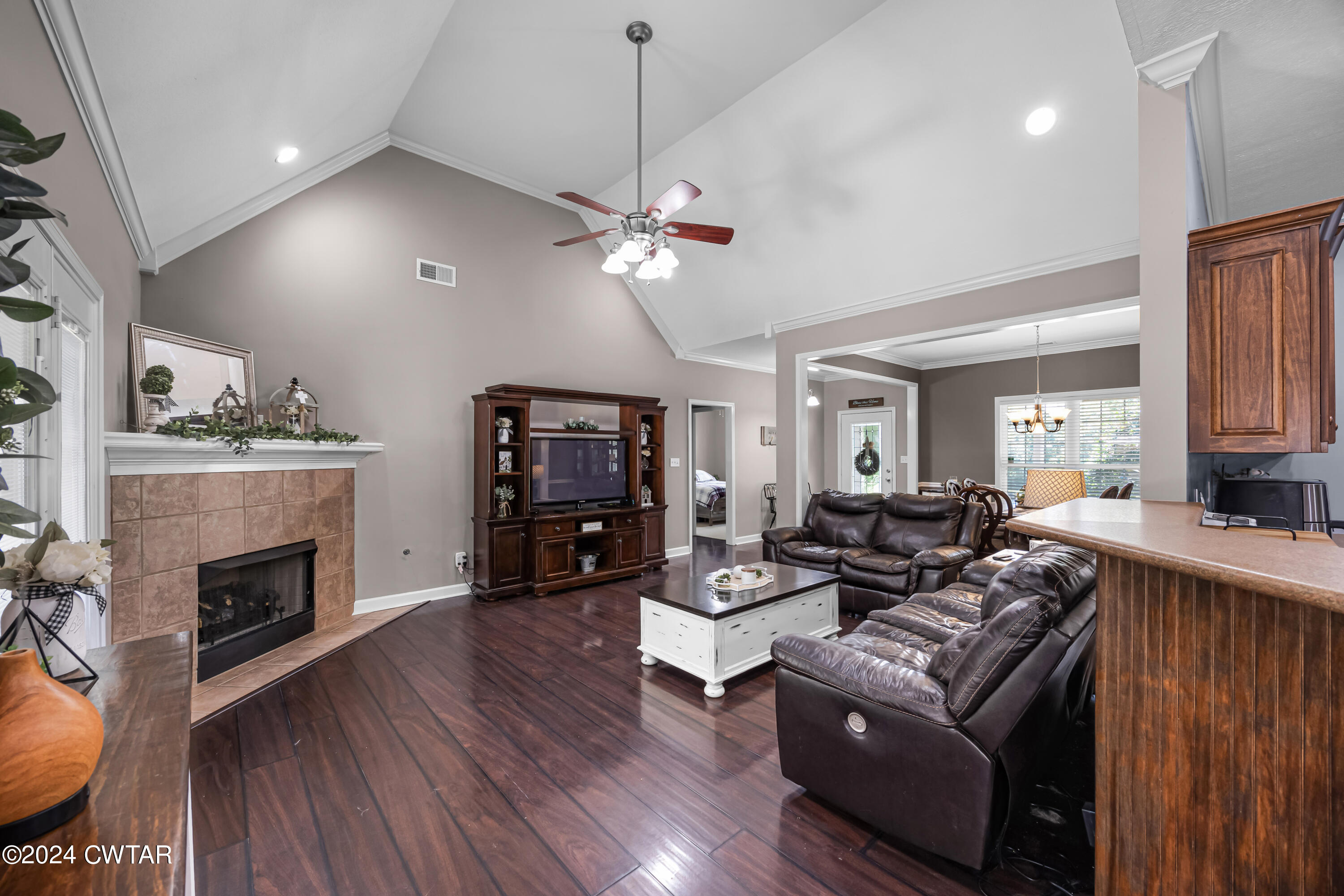 245 Station Road Beech Bluff, TN 38313 - Photo 7 of 23 a living room with furniture a fireplace and a flat screen tv