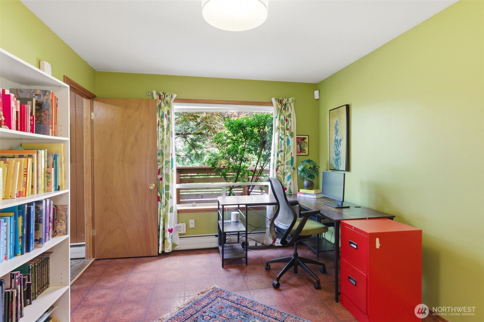 2803 South Walker Street Seattle, WA 98144 - Photo 10 of 40 a workspace with furniture and a book shelf