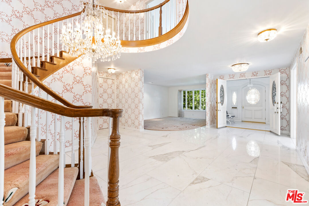 218 Foothill Road Beverly Hills, CA 90210 - Photo 9 of 16 a view of an entryway with wooden floor