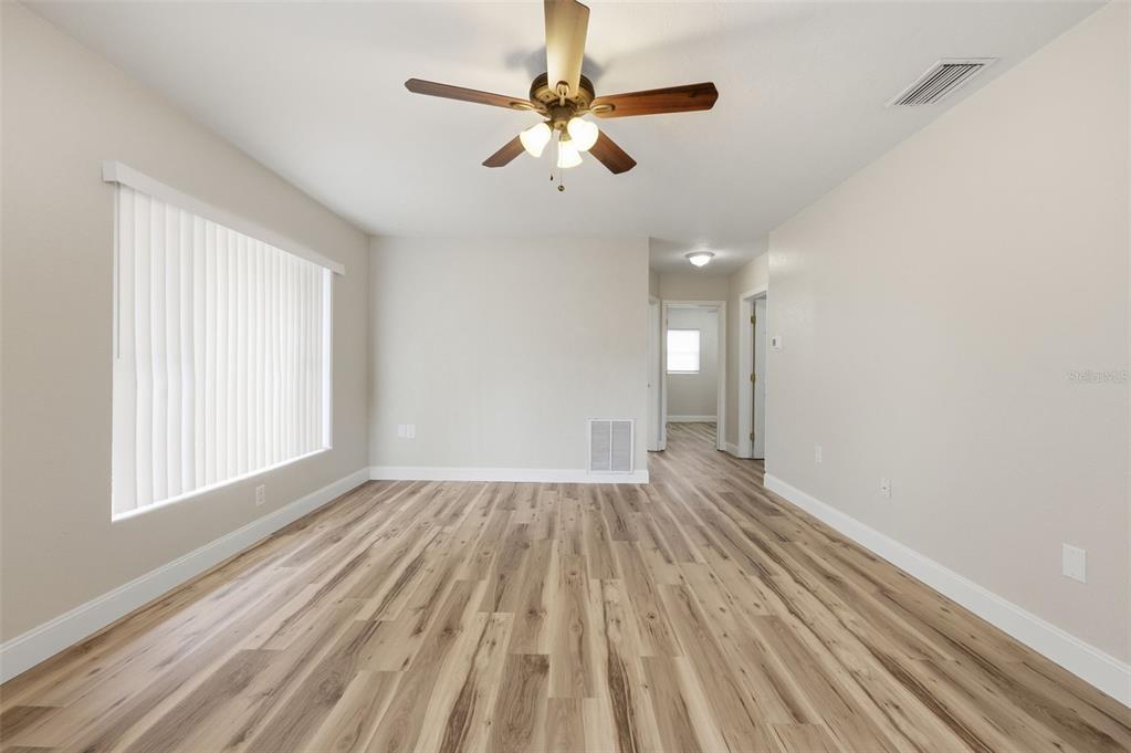 5340 Dartmouth Road New Port Richey, FL 34652 - Photo 11 of 41 wooden floor in an empty room with a window