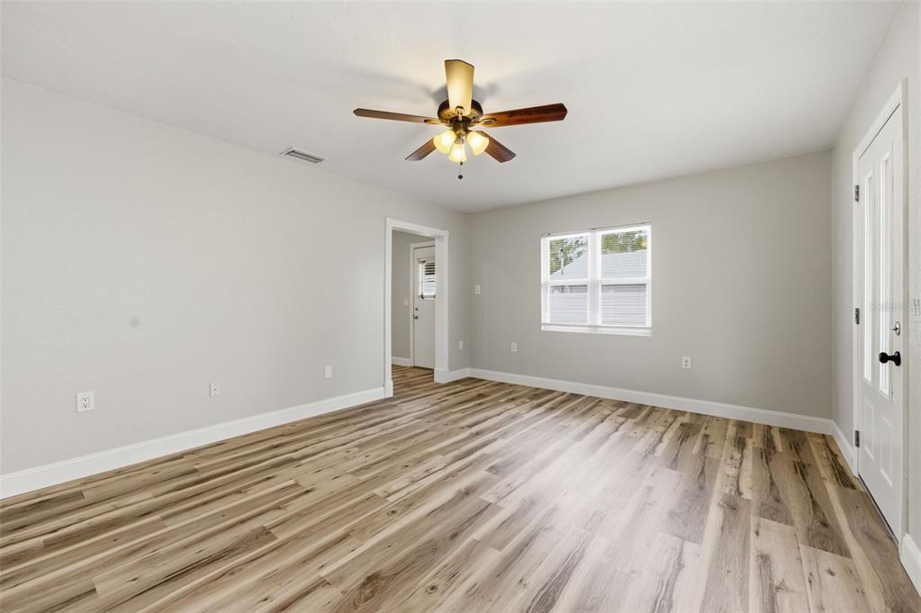 5340 Dartmouth Road New Port Richey, FL 34652 - Photo 13 of 41 a view of empty room with wooden floor and fan