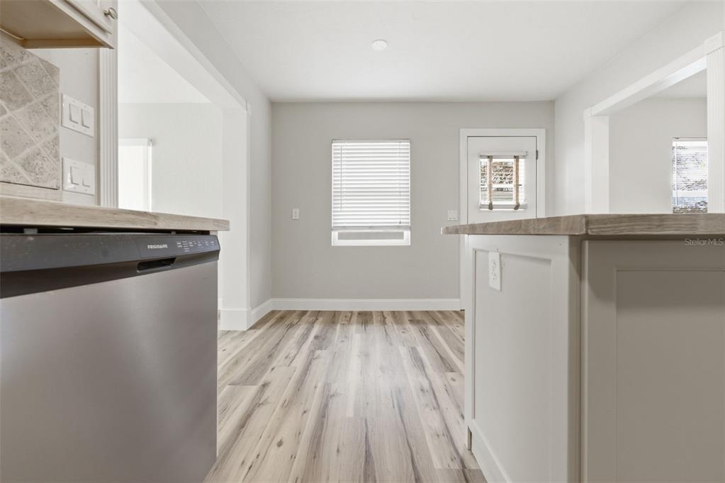5340 Dartmouth Road New Port Richey, FL 34652 - Photo 18 of 41 a kitchen with wooden floor and a window