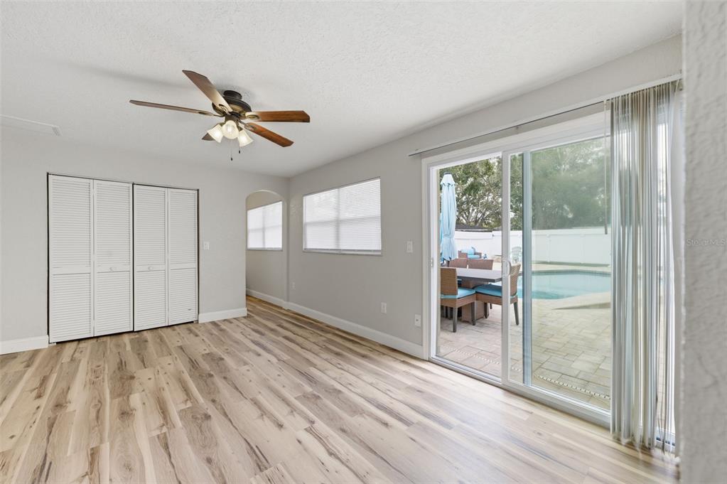 5340 Dartmouth Road New Port Richey, FL 34652 - Photo 21 of 41 a view of empty room with wooden floor and fan