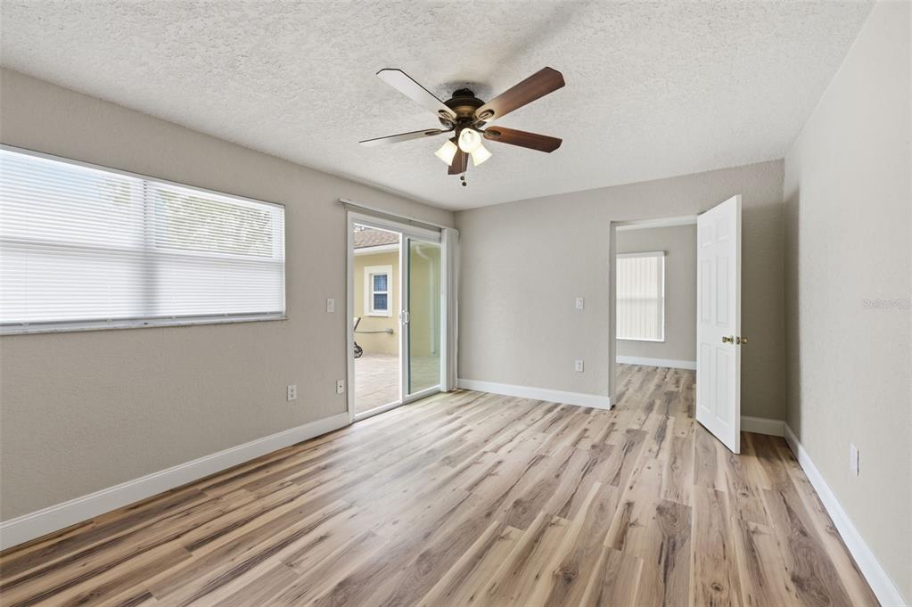 5340 Dartmouth Road New Port Richey, FL 34652 - Photo 22 of 41 a view of an empty room with wooden floor and a window