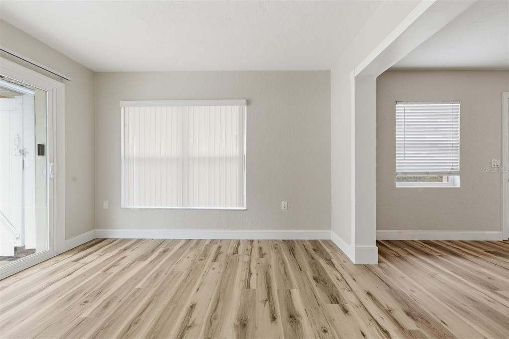 5340 Dartmouth Road New Port Richey, FL 34652 - Photo 24 of 41 an empty room with wooden floor and windows