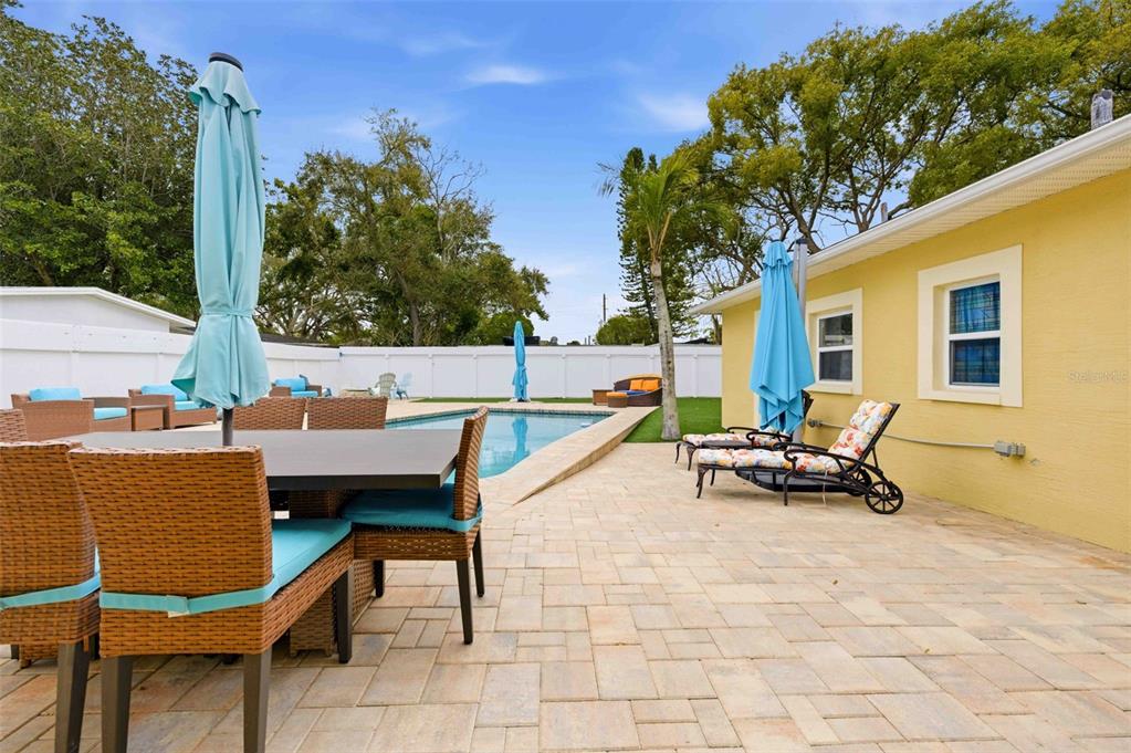 5340 Dartmouth Road New Port Richey, FL 34652 - Photo 33 of 41 a view of a patio with a table and chairs