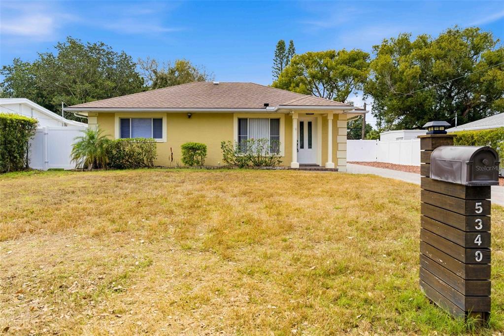 5340 Dartmouth Road New Port Richey, FL 34652 - Photo 38 of 41 a front view of a house with a yard