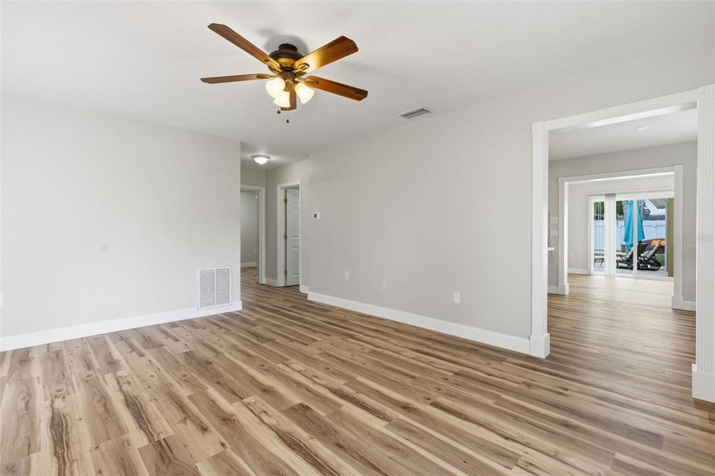 5340 Dartmouth Road New Port Richey, FL 34652 - Photo 10 of 41 wooden floor in an empty room with a window