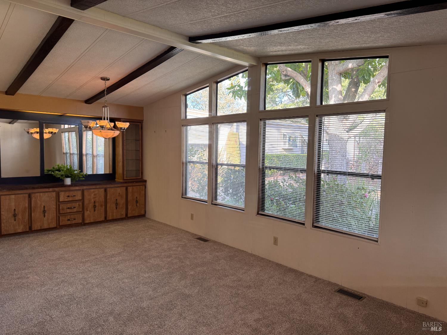 97 Glenoak Court Santa Rosa, CA 95409 - Photo 8 of 35 Vaulted ceilings and large windows in the living room.