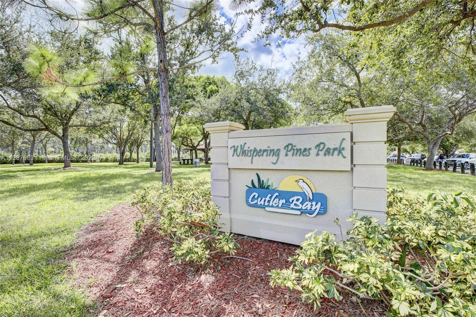 8751 Ridgeland Drive Cutler Bay, FL 33157 - Photo 21 of 26 a sign on the side of the road